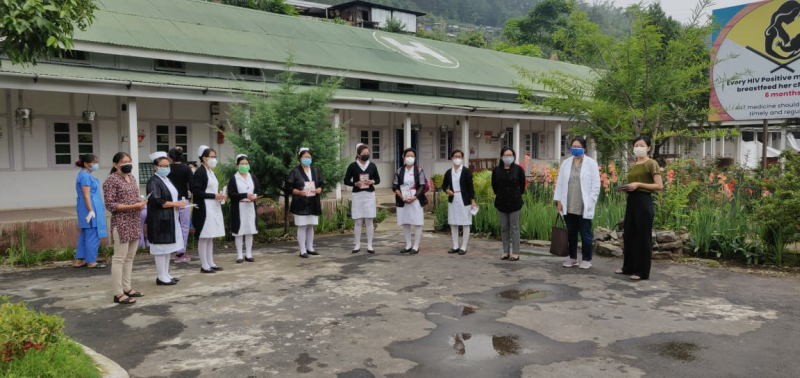 Dr Daisy Ovung, DNO, NTCP Wokha distributing pamphlets and hand sanitizers to health workers at Dr Motsuo Memorial District Hospital Wokha on May 31. (Photo Courtesy: CMO office Wokha)